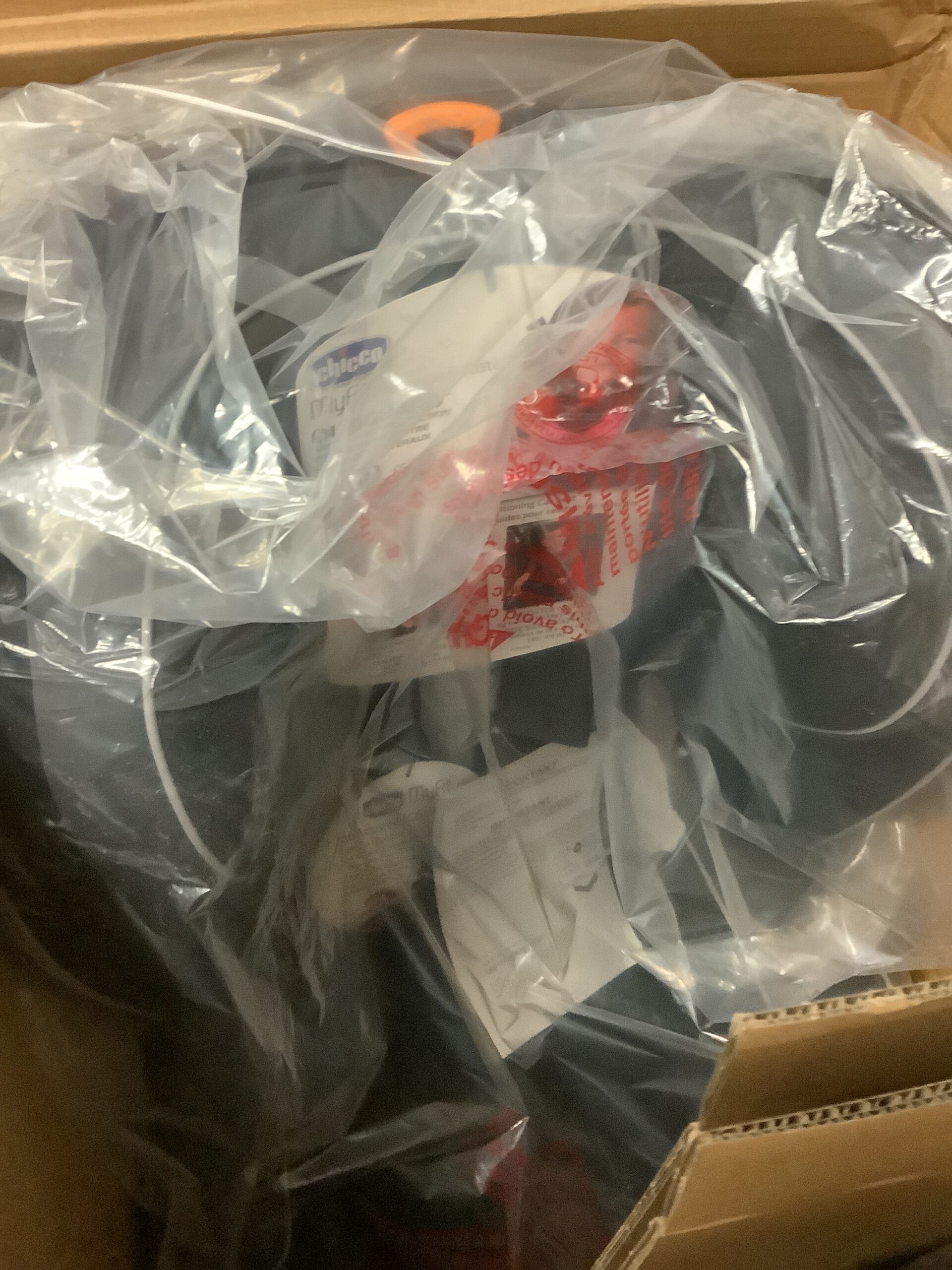 Chicco harness booster car seat in black and grey with professional photography