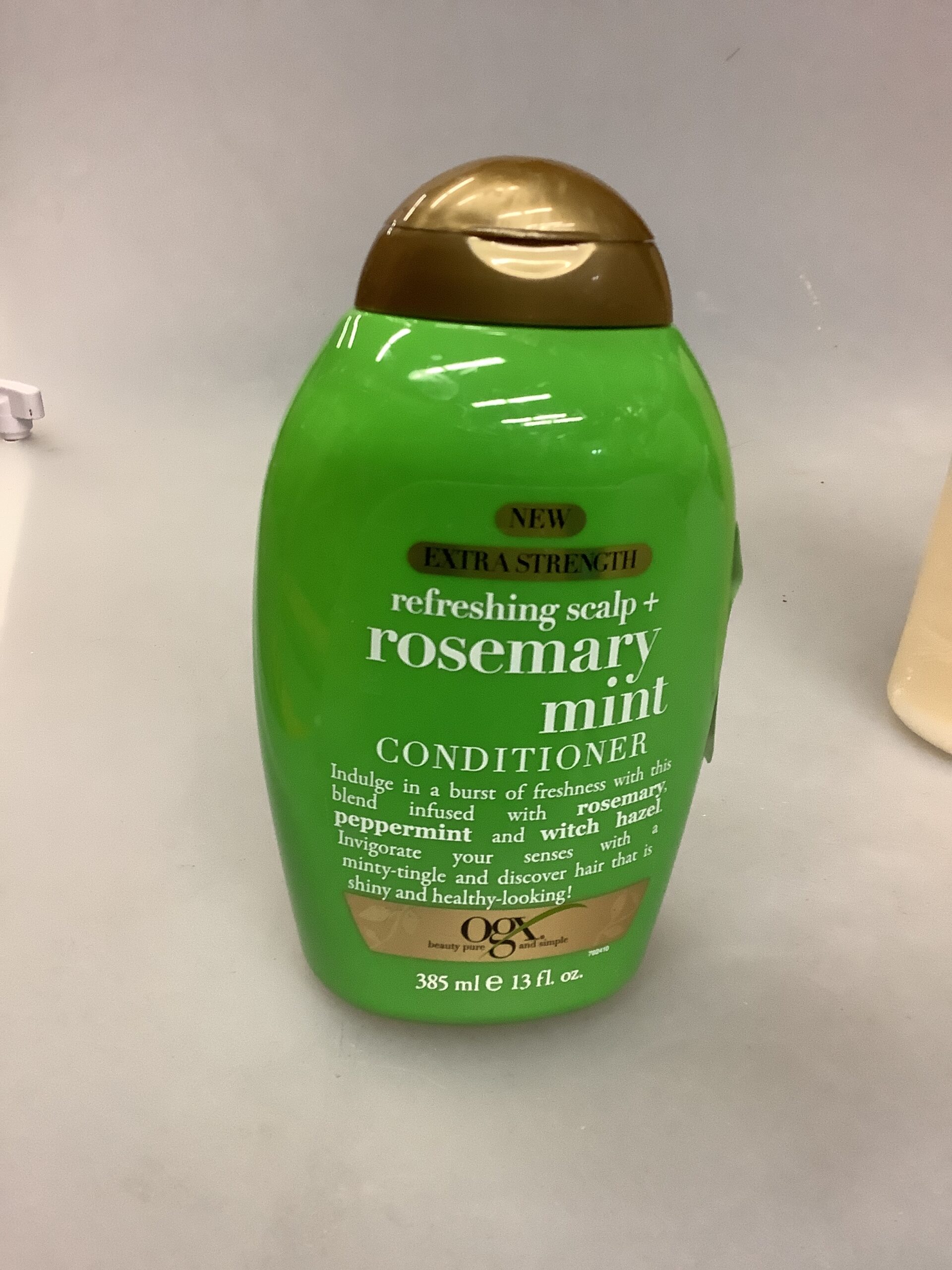 OGX refreshing scalp conditioner in 385ml bottle with tea tree mint