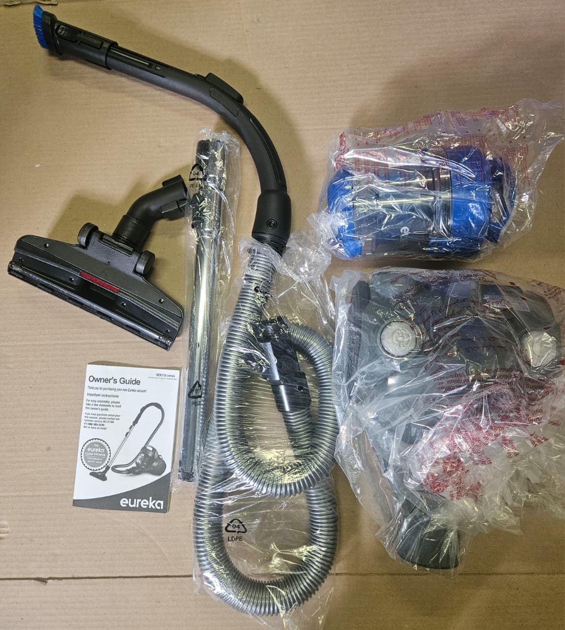 Eureka bagless canister vacuum in blue for carpets and hard floors