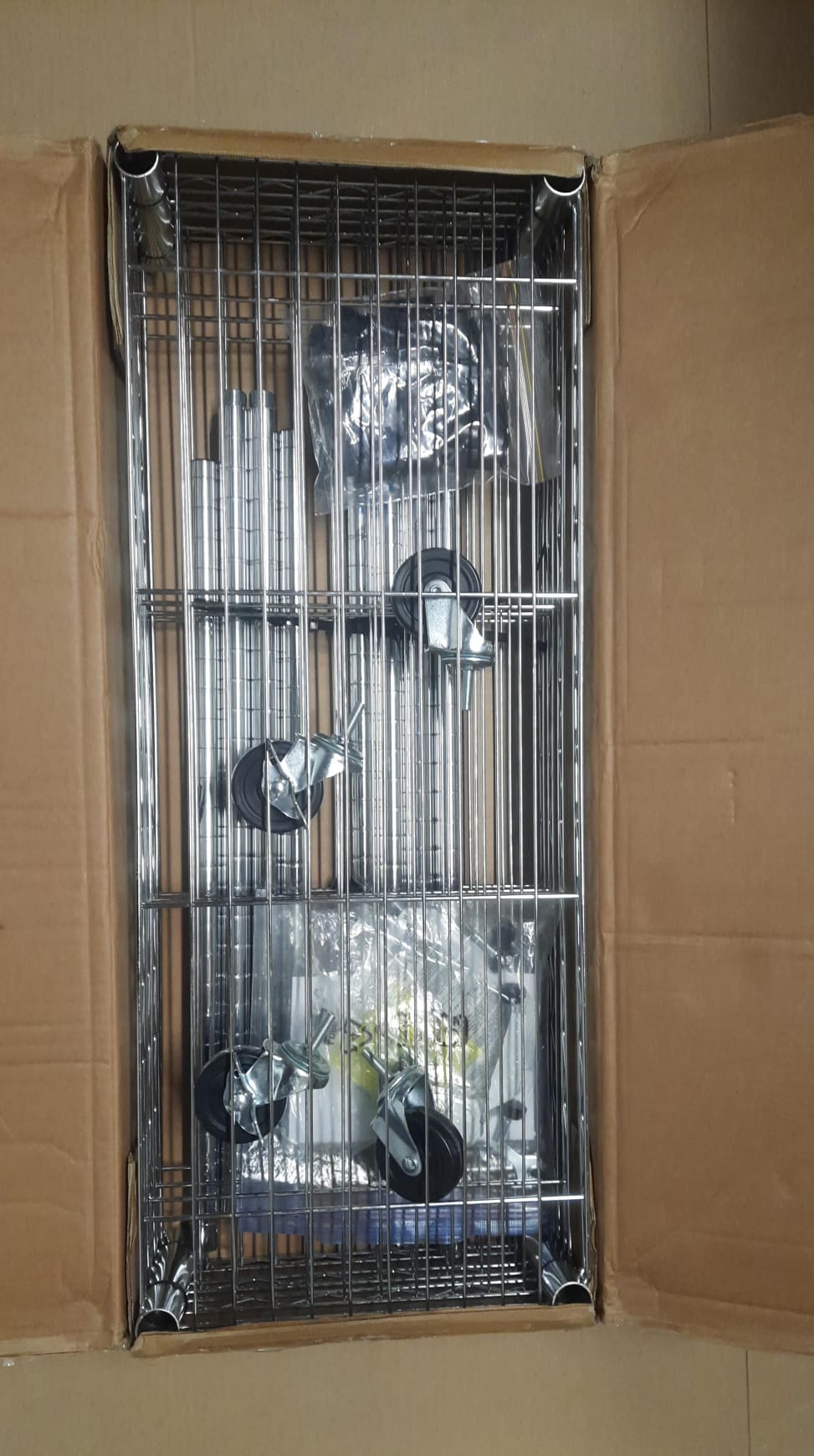 Amazon Basics adjustable shelving unit in chrome finish with wheels