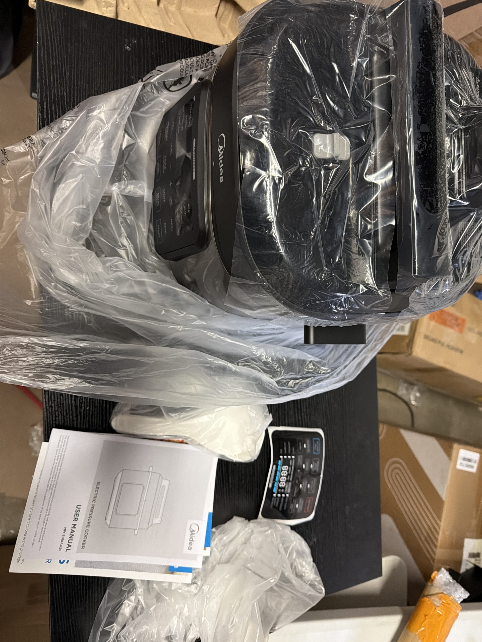 Midea electric pressure cooker in stainless steel with 12 presets and multifunction features