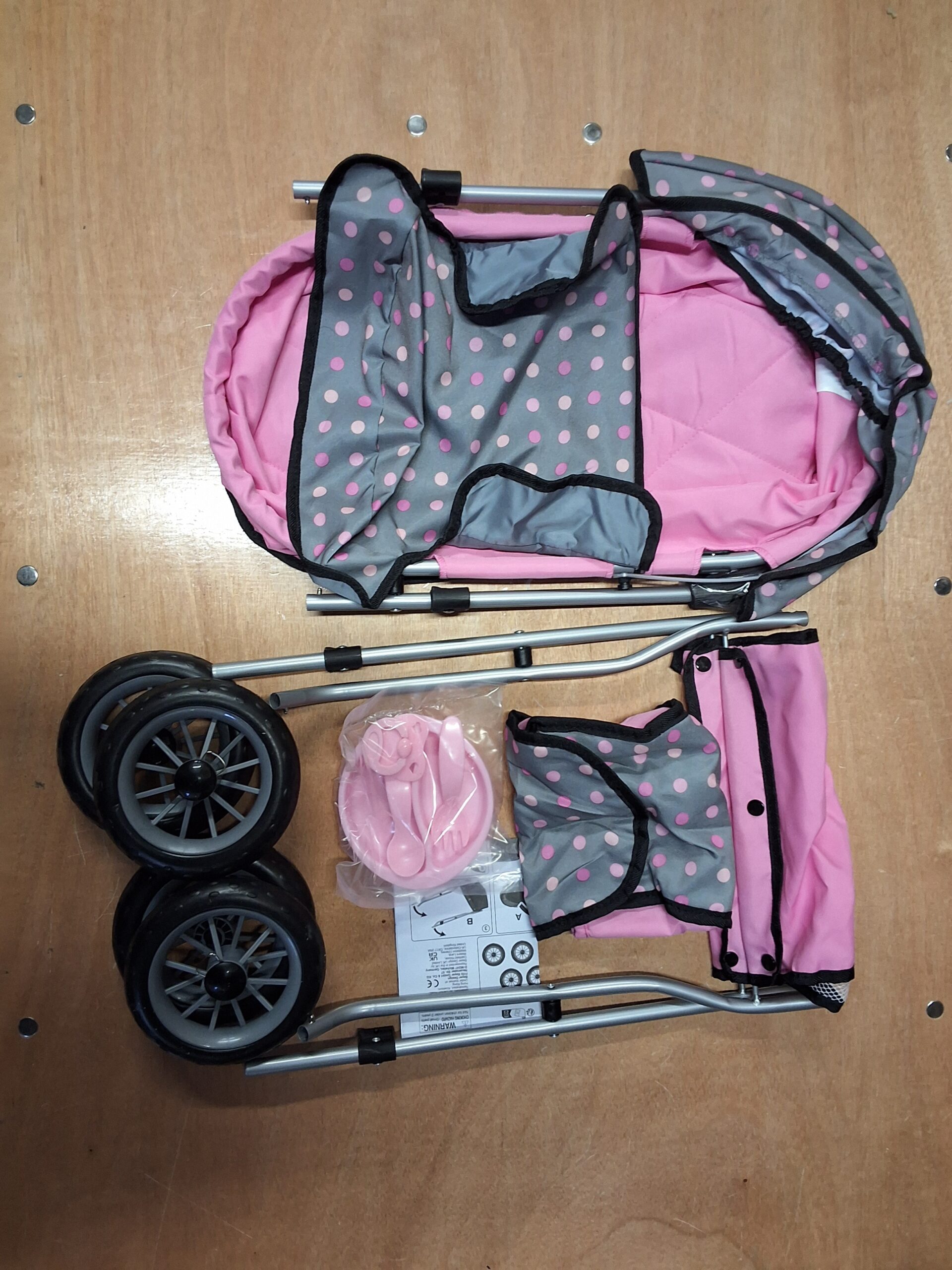 Bayer baby stroller for dolls in grey with pink dots and plastic accessories