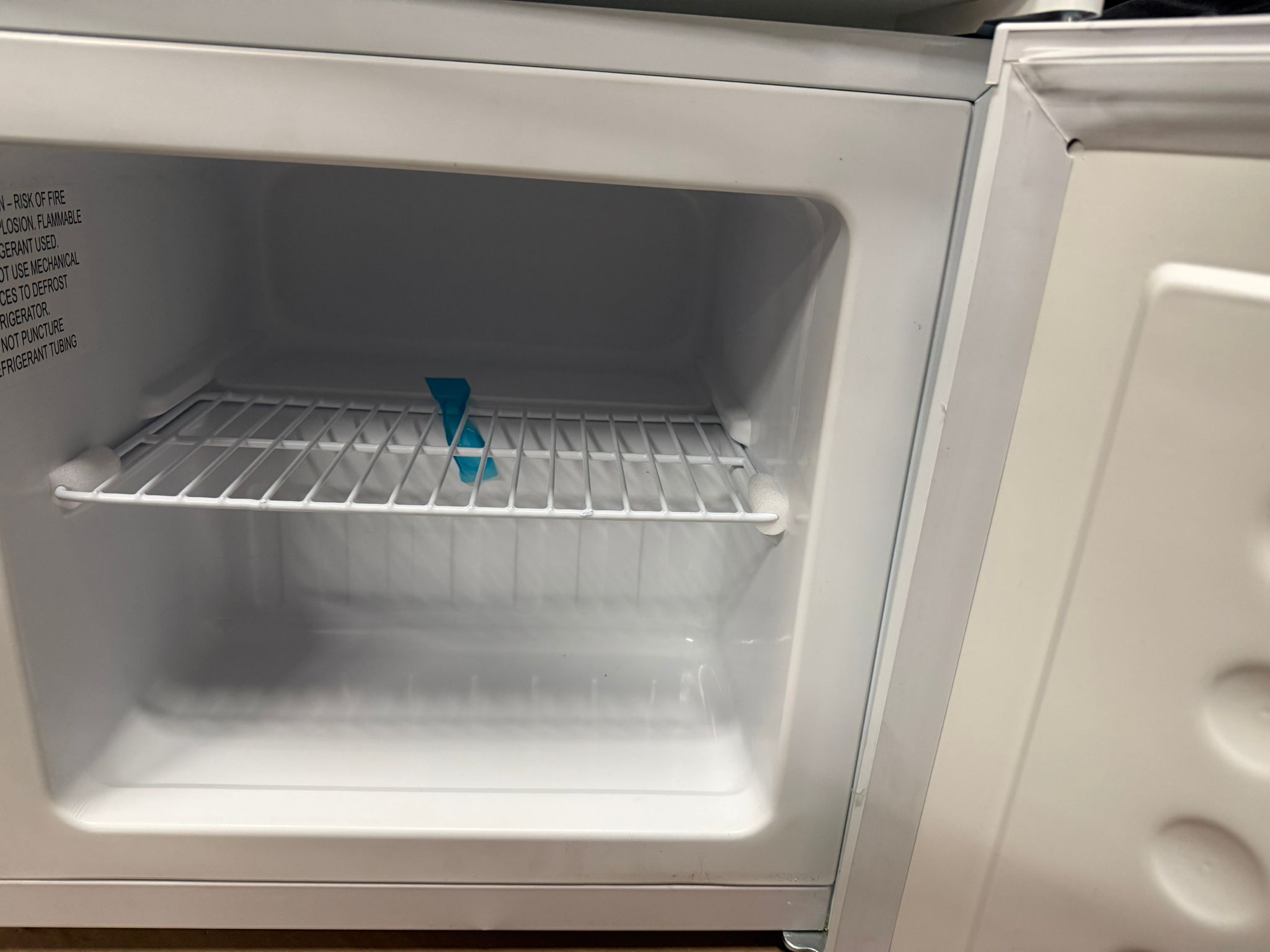 Koolatron mini upright freezer in white, space-saving design